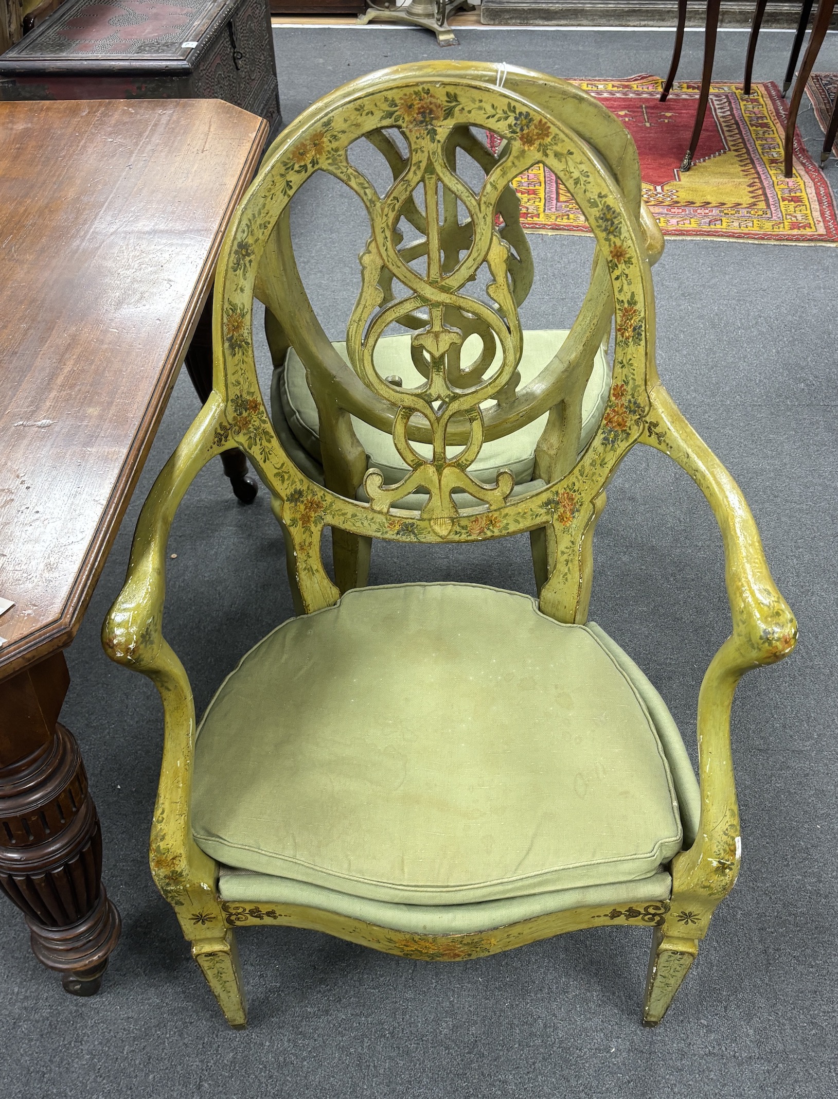 A set of four late 18th century Continental green painted elbow chairs, width 62cm, depth 50cm, height 100cm